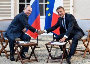 French President Emmanuel Macron (R) shakes hands with Russia's President Vladimir Putin at the end of their meeting, at his summer retreat of the Bregancon fortress on the Mediterranean coast, near the village of Bormes-les-Mimosas, southern France, on August 19, 2019, for talks days before the G7 Summit . (Photo by GERARD JULIEN / various sources / AFP) (Photo credit should read GERARD JULIEN/AFP/Getty Images)