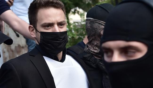 ATHENS, GREECE - JUNE 18: Babis Anagnostopoulos leaves the court escorted by police on June 18, 2021 in Athens, Greece. On June 17th Babis Anagnostopoulos, a 32-year-old pilot, confessed to having killed his British wife Caroline Crouch on May 11th, after Greek police disproved his initial claim that she had been killed during a robbery. (Photo by Milos Bicanski/Getty Images)