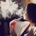 young woman smoking electronic cigarette