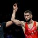 Islam Dudaev of Albania (Red) v Baku Akazawa of Samoa (Blue) during the Olympic Games mens 100m relay final at the Stade de France in Paris, France on the August 10, 2024 ©Barry Aldworth/BackpagePix