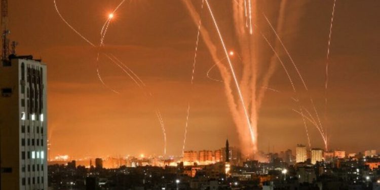 Rockets light up the night sky as they are fired towards Israel from Beit Lahia in the northern Gaza Strip on May 14, 2021. - Israel bombarded Gaza with artillery and air strikes on Friday, May 14, in response to a new barrage of rocket fire from the Hamas-run enclave, but stopped short of a ground offensive in the conflict that has now claimed more than 100 Palestinian lives.
As the violence intensified, Israel said it was carrying out an attack "in the Gaza Strip" although it later clarified there were no boots on the ground. (Photo by MOHAMMED ABED / AFP)