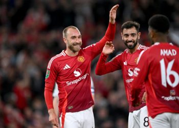 MANCHESTER, ENGLAND - SEPTEMBER 17: Christian Eriksen of Manchester United celebrates scoring his team's sixth goal with teammates Bruno Fernandes and mun16as during the Carabao Cup Third Round match between Manchester United and Barnsley at Old Trafford on September 17, 2024 in Manchester, England. (Photo by Stu Forster/Getty Images)